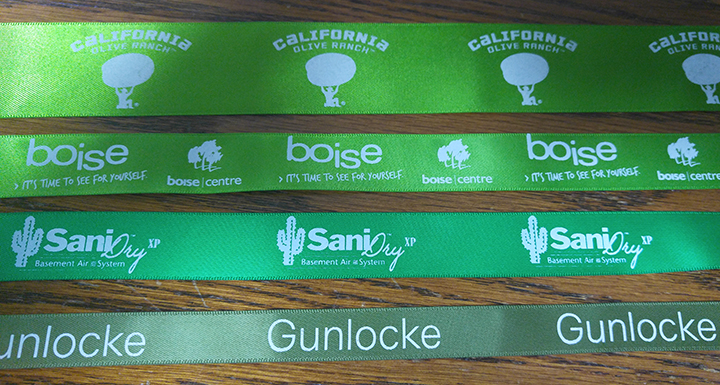 Custom logo ribbon, logo spacing on ribbon, green satin ribbon, custom branding ribbon, white print on ribbon