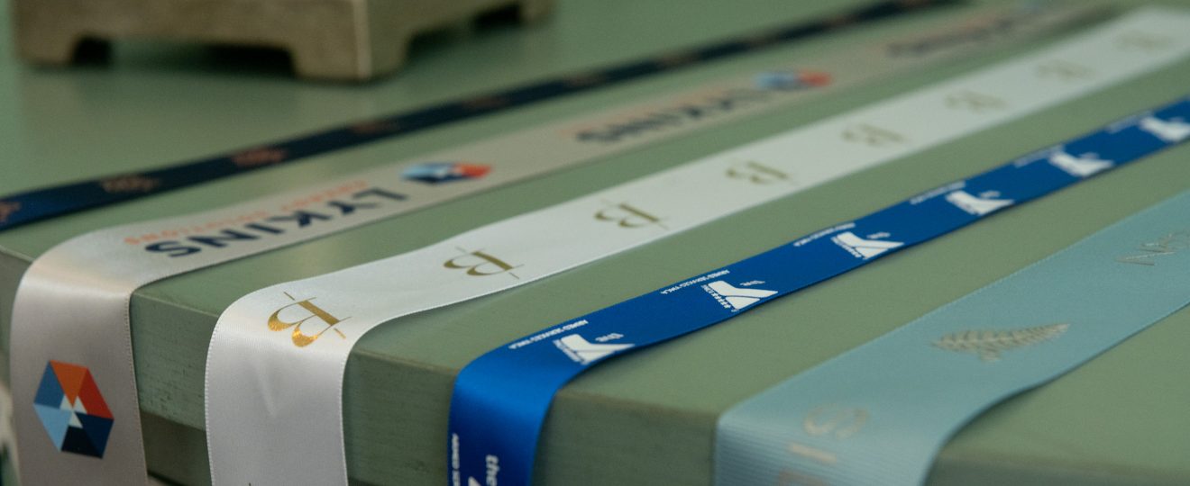 custom branded ribbon, custom dyed ribbon, satin logo ribbon, ribbon with logo, promotional ribbon, corporate logo ribbon, custom event ribbon, personalized logo ribbon