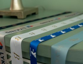 custom branded ribbon, custom dyed ribbon, satin logo ribbon, ribbon with logo, promotional ribbon, corporate logo ribbon, custom event ribbon, personalized logo ribbon