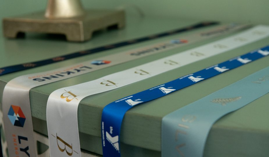 custom branded ribbon, custom dyed ribbon, satin logo ribbon, ribbon with logo, promotional ribbon, corporate logo ribbon, custom event ribbon, personalized logo ribbon