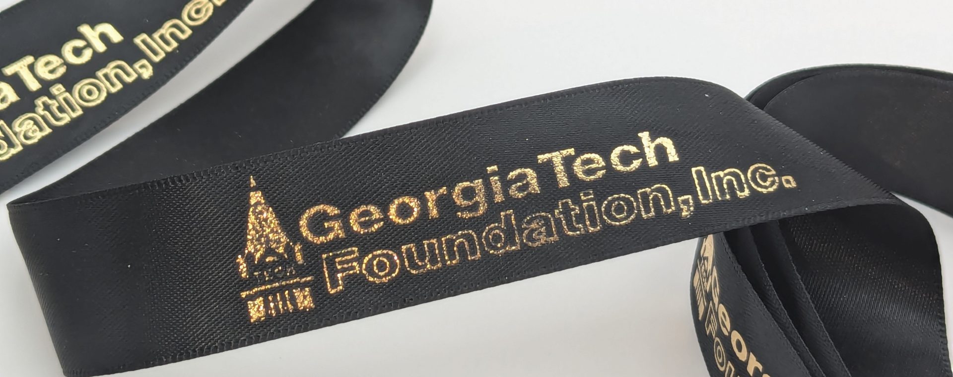 custom ribbon logo, custom ribbon printing, custom ribbon with company logo, custom satin ribbon, logo branded ribbon, logo on ribbon