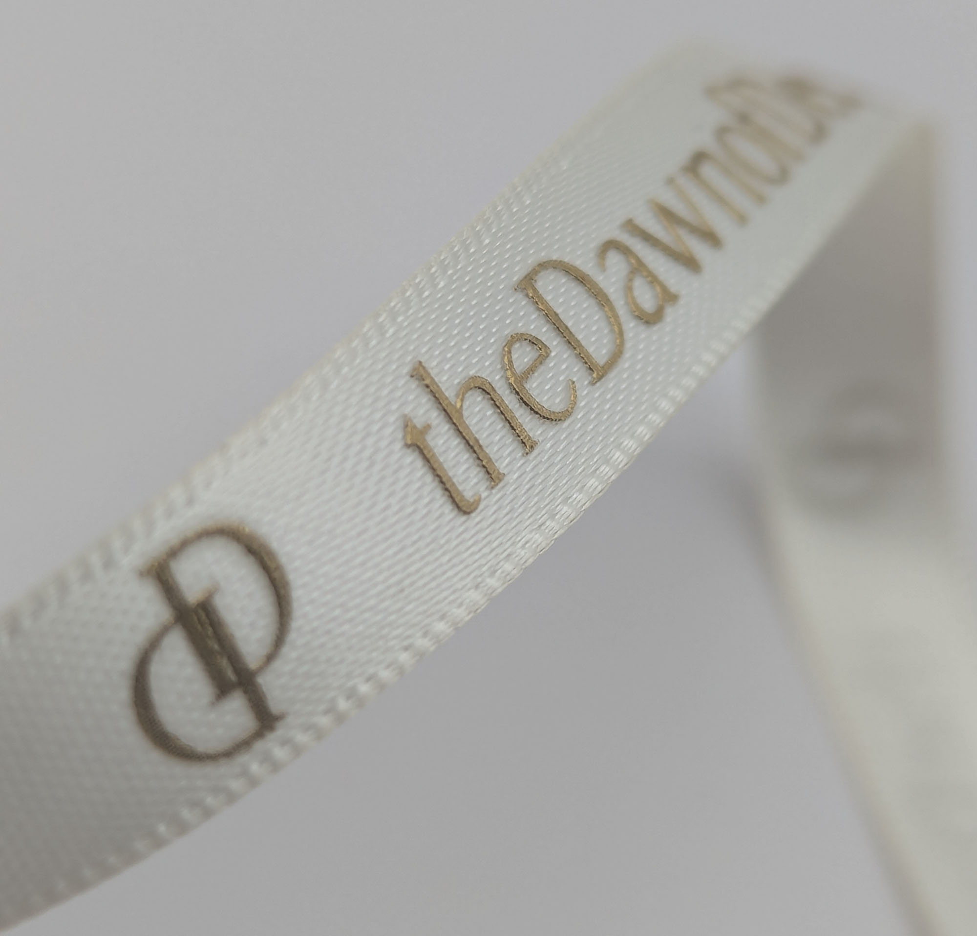 custom logo ribbon ribbon, raised print on satin ribbon, satin logo ribbon with gold print, embossed print on logo ribbon