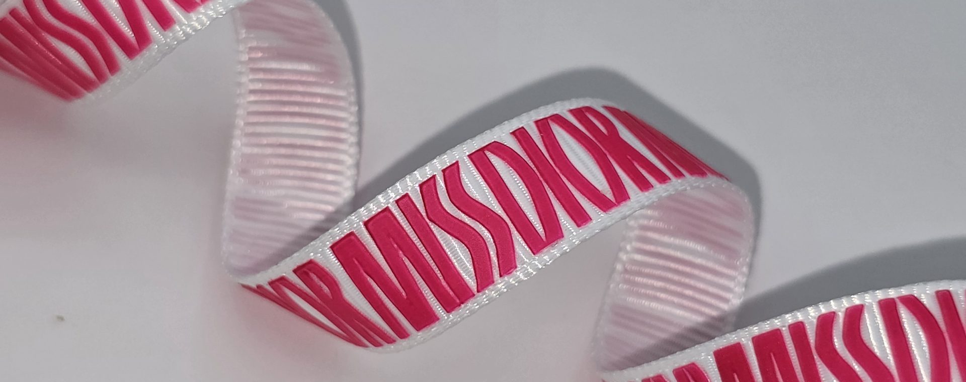 custom logo ribbon, raised print on grosgrain ribbon, Pantone matching print, custom logo grosgrain ribbon, custom branding ribbon, raised print on ribbon